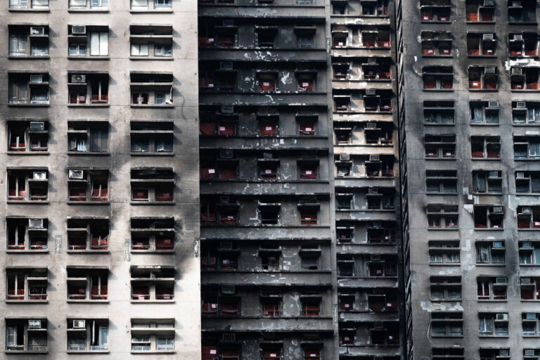 Hong Kong Residents Return to Burned Homes